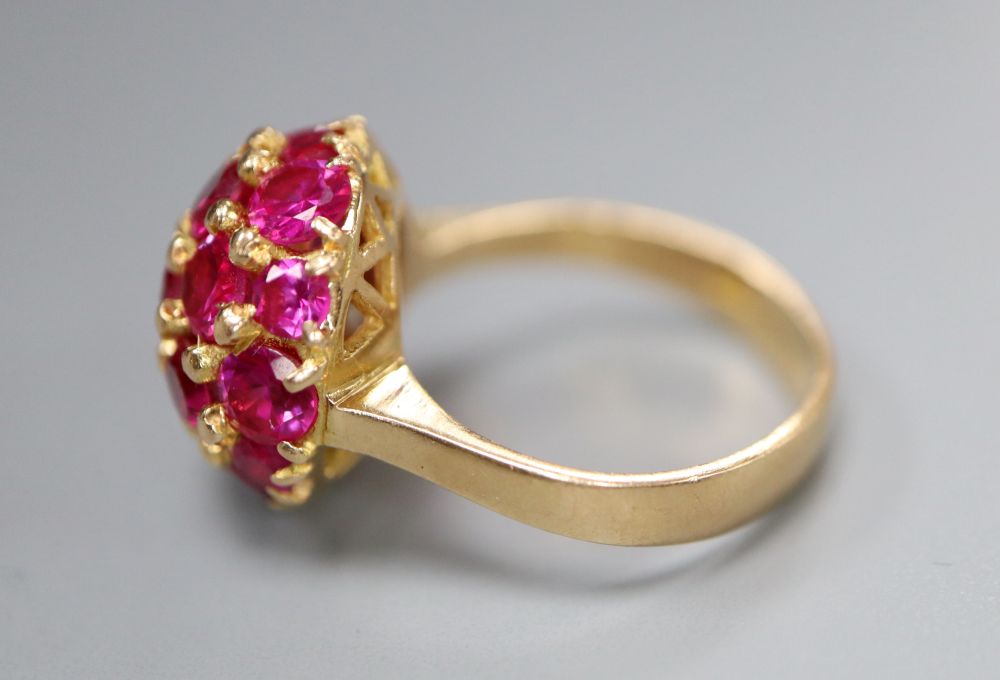 A mid to late 20th century Italian? 750 and synthetic? ruby cluster dress ring, size M/N, gross 8.3 grams.